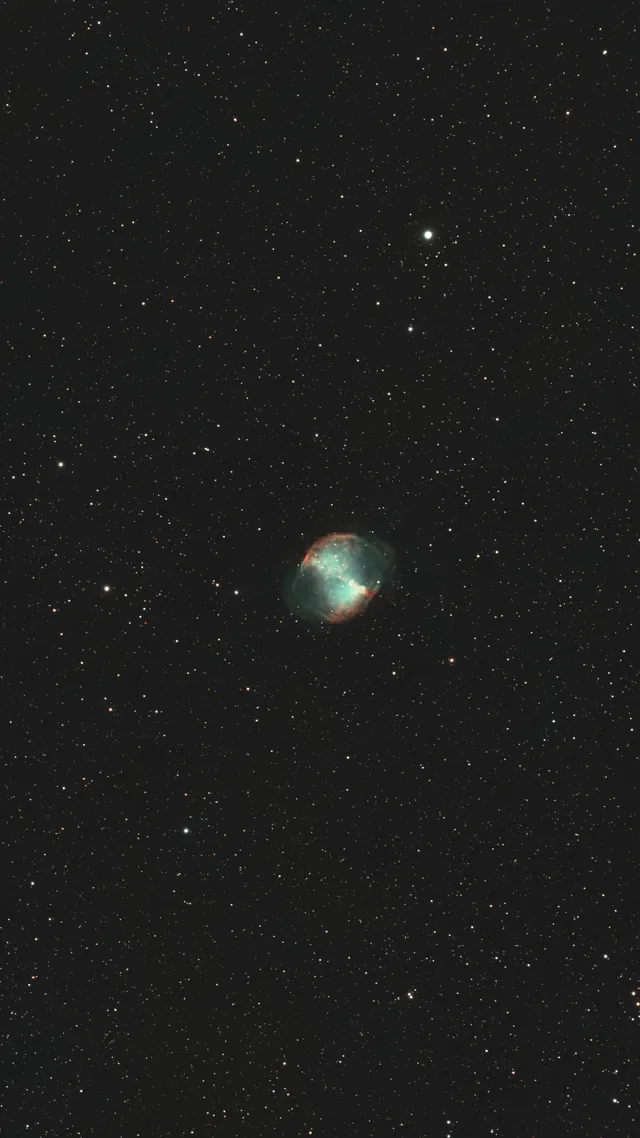 The Dumbbell Nebula in a dense star field