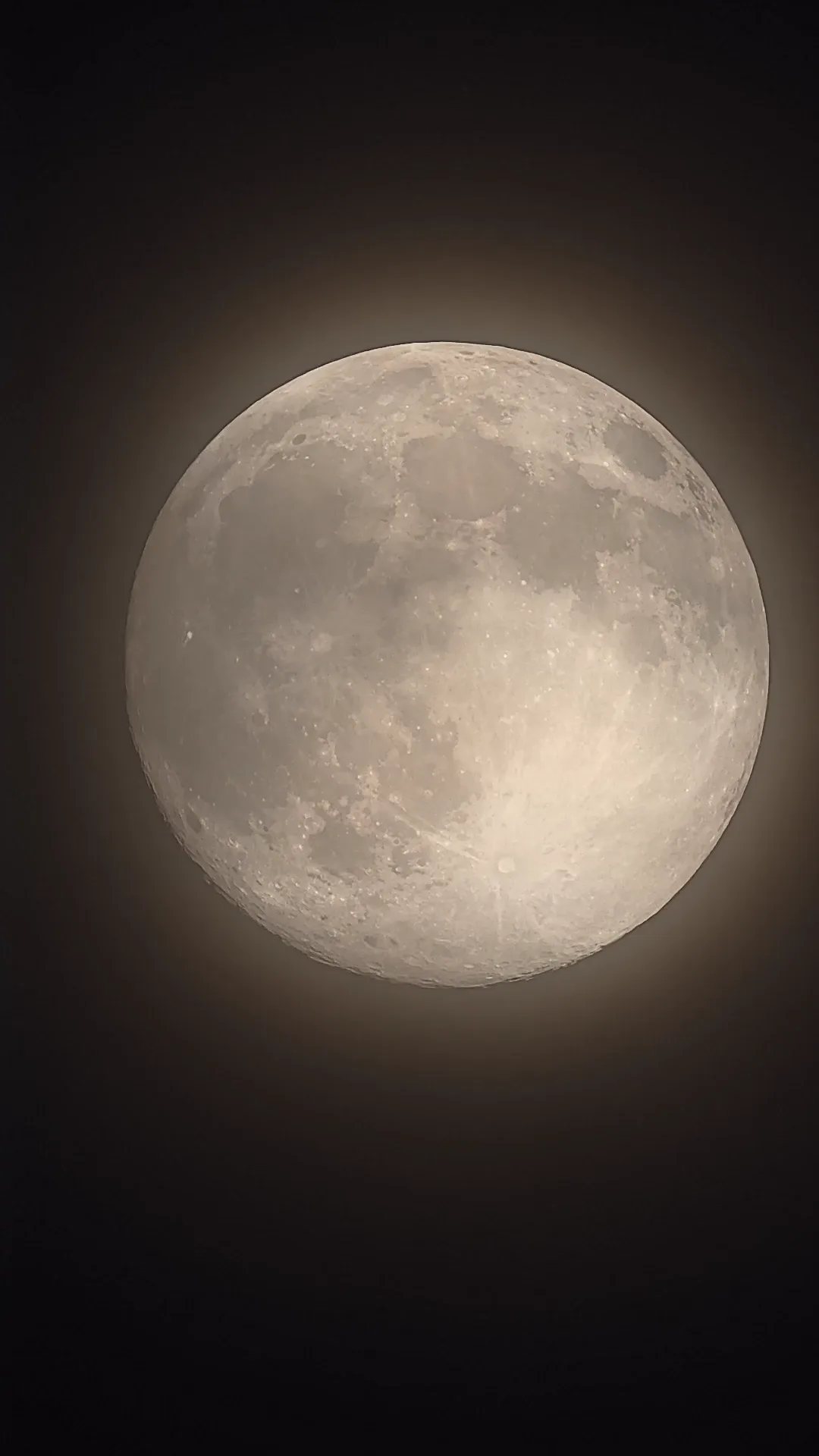 The Moon moving behind passing clouds