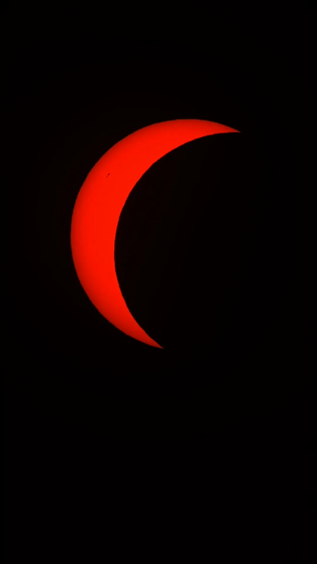 A partial solar eclipse progressing across the Sun
